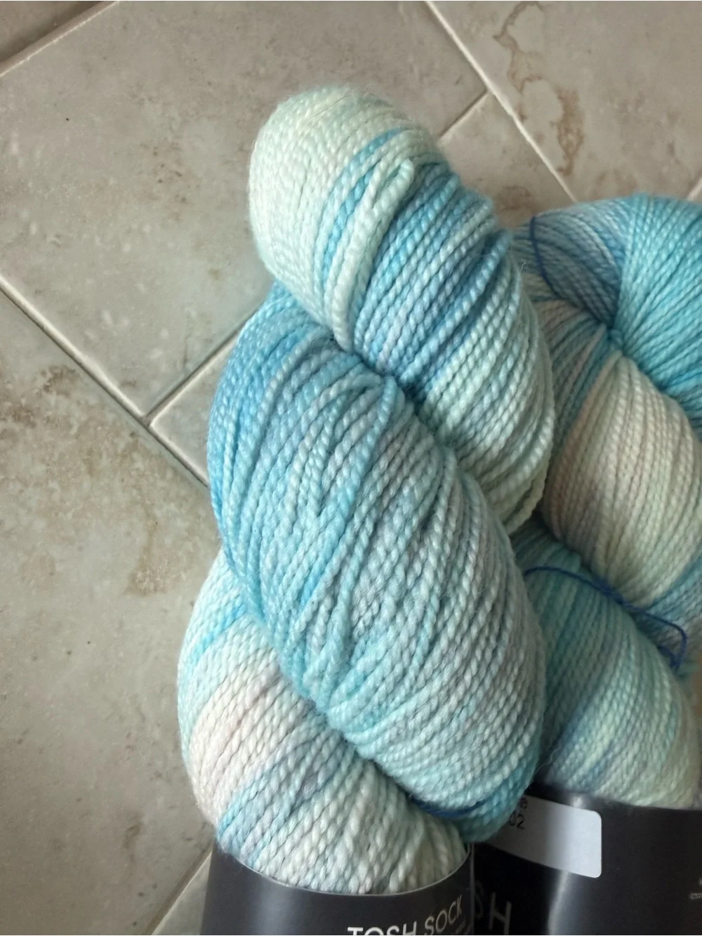 Madelinetosh Hand-Dyed Yarn Skeins in Aqua and Pale Blue